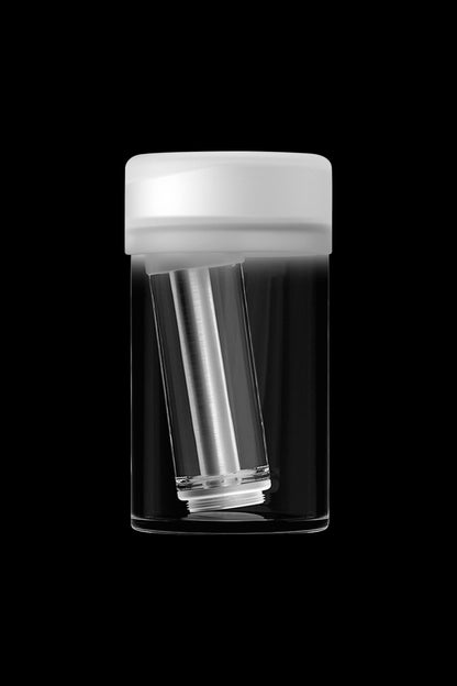 Clear cannabis oil cartridge inside a protective tube on a black background.