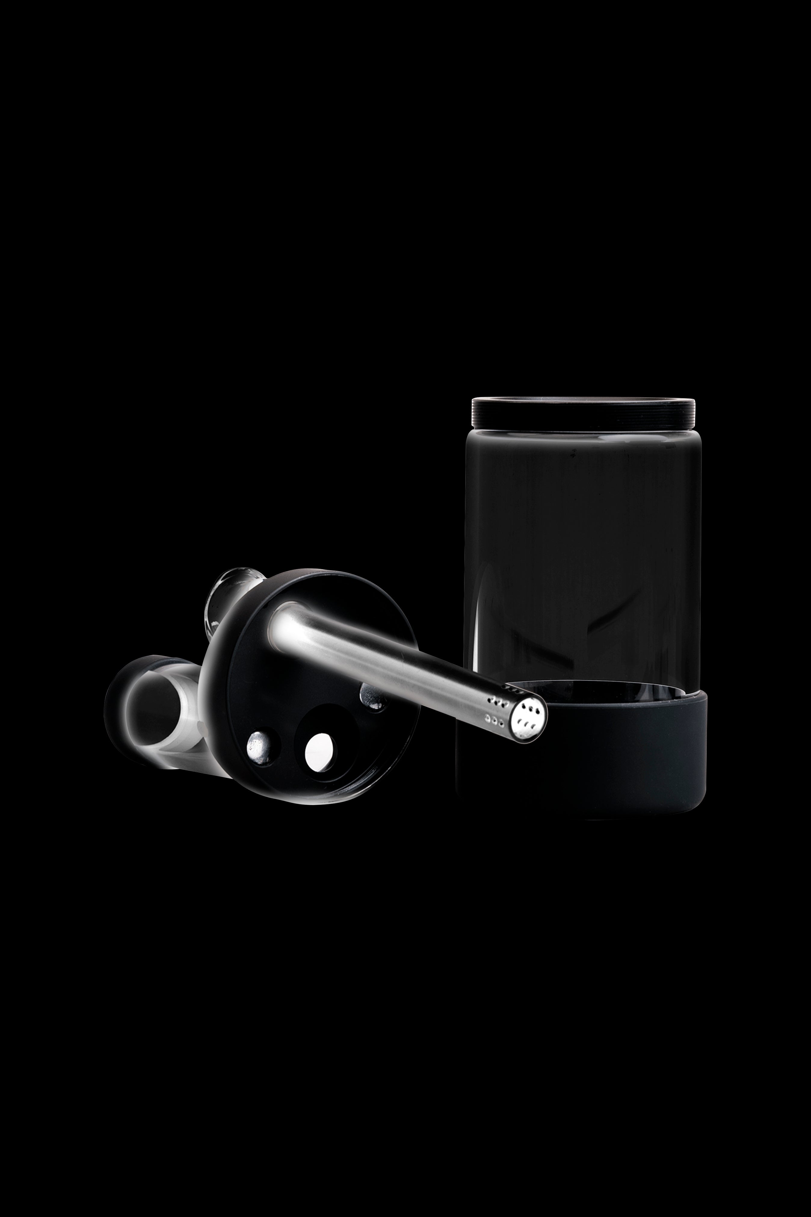 Black cannabis dab rig with glass carb cap and container.