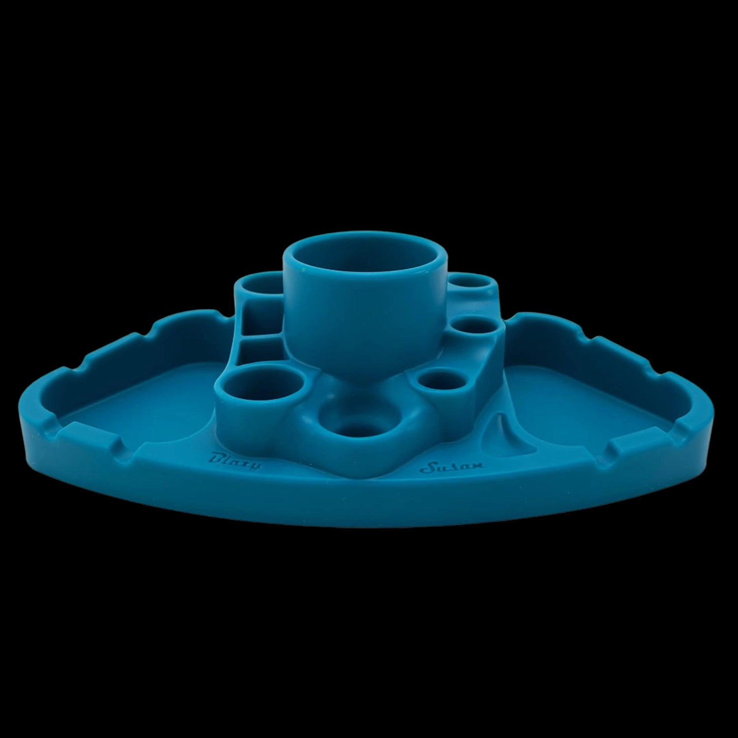 Low-angle front view of the blue Blazy Susan Deluxe Dab Station showing its central cup, multiple tool holes, and scalloped tray edges.