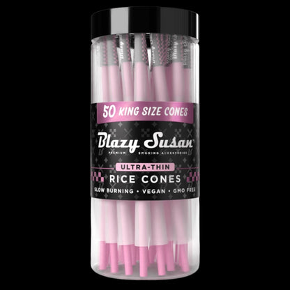 Centered front view of a clear jar of pink Blazy Susan Ultra Thin Rice Cones with a black label and reflective black cap against black.