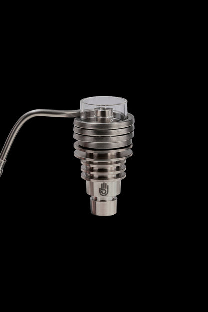 Silver cannabis concentrate vaporizer coil with a glass carb cap attached.