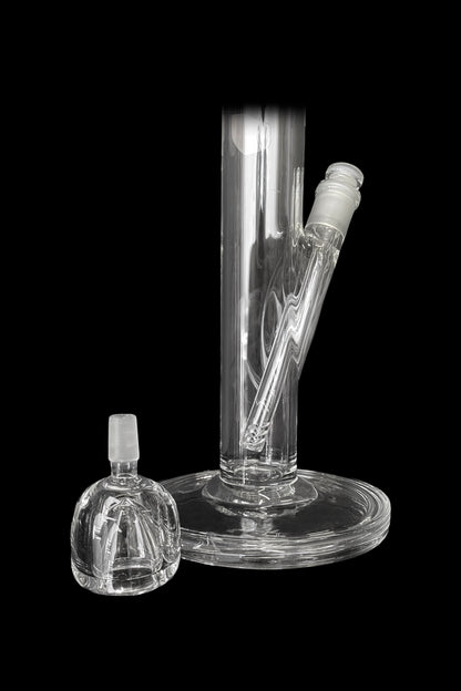 Clear glass bong and attachment on a black background.