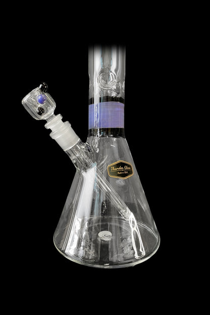 Clear glass water pipe (bong) with blue accents and a glass bowl, against a black background.
