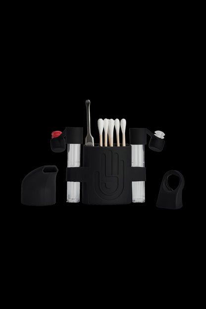 Black cannabis smoking kit with various tools and cartridges arranged around a central case.