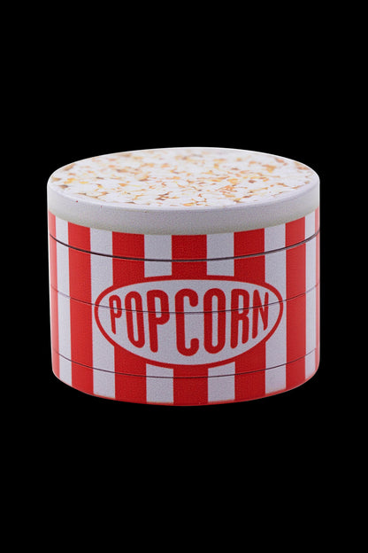 Red and white striped grinder with a popcorn-themed top.