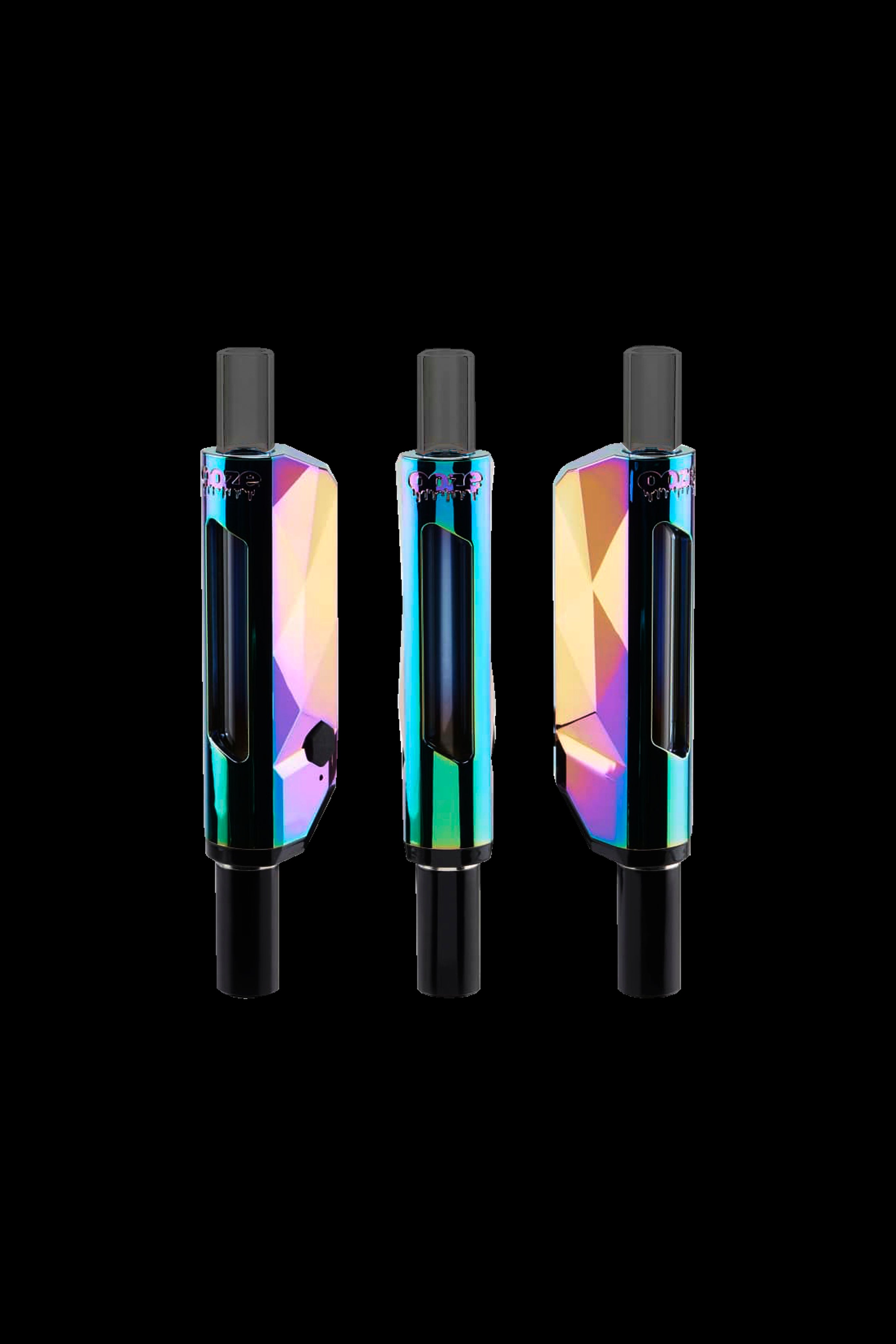 Three iridescent cannabis vaporizers against a black background.