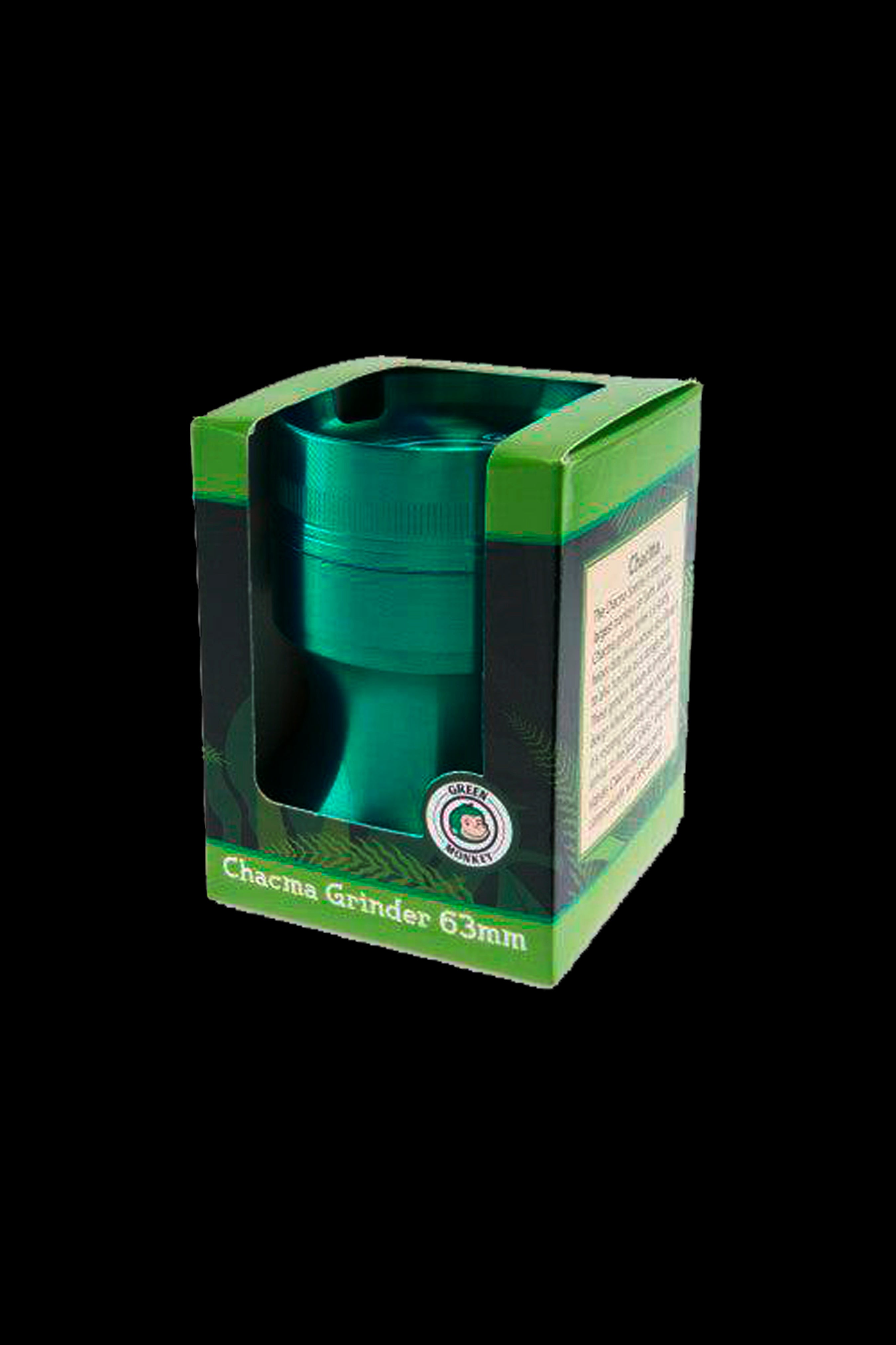 Angled close-up of the Rainbow Green Monkey Chacma Grinder with Ashtray peeking from its green display box against a black background