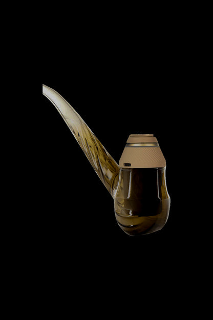 Angled close-up of the Flourish-colored Puffco Proxy Wizard showing its curved glass neck and textured beige top against a black background
