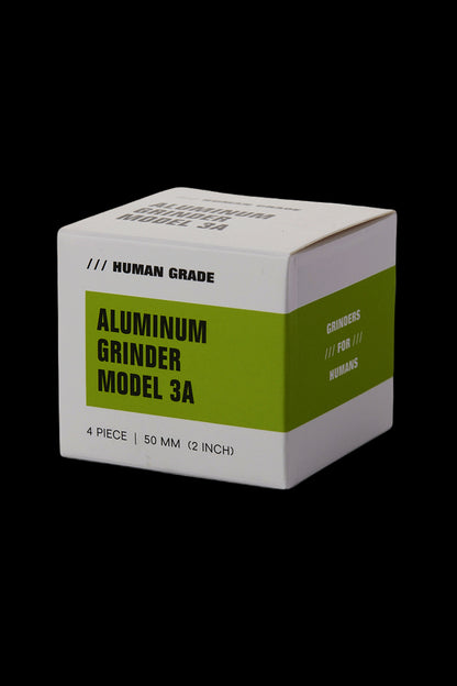 Olive green aluminum cannabis grinder box with text reading "Aluminum Grinder Model 3A" and "Grinders /// For /// Humans".