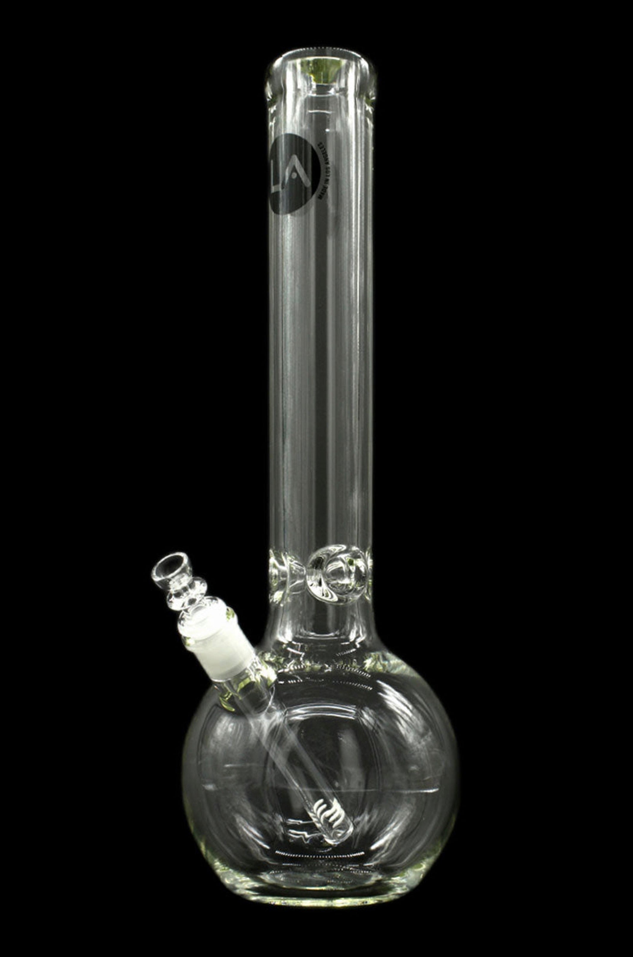 Clear glass water pipe (bong) with intricate swirling patterns and a diffused downstem, isolated on a black background.