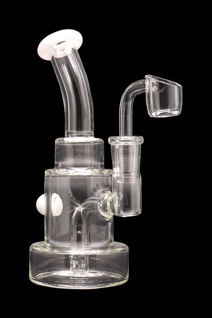 Clear glass dab rig with bubbler and quartz banger.