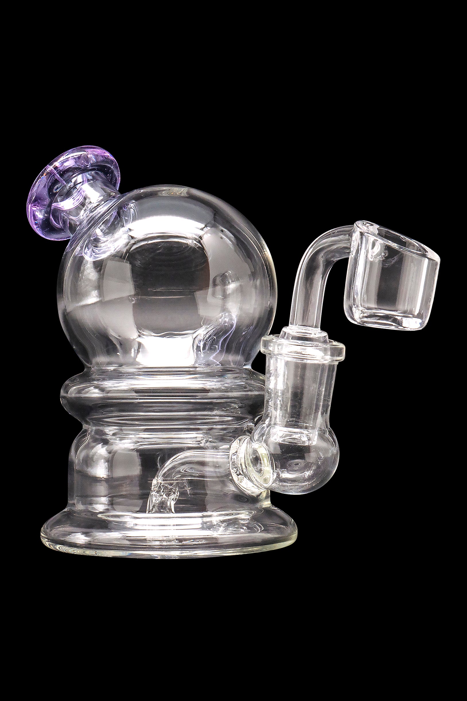 Clear glass dab rig with purple accents, featuring a spherical percolator and quartz banger.