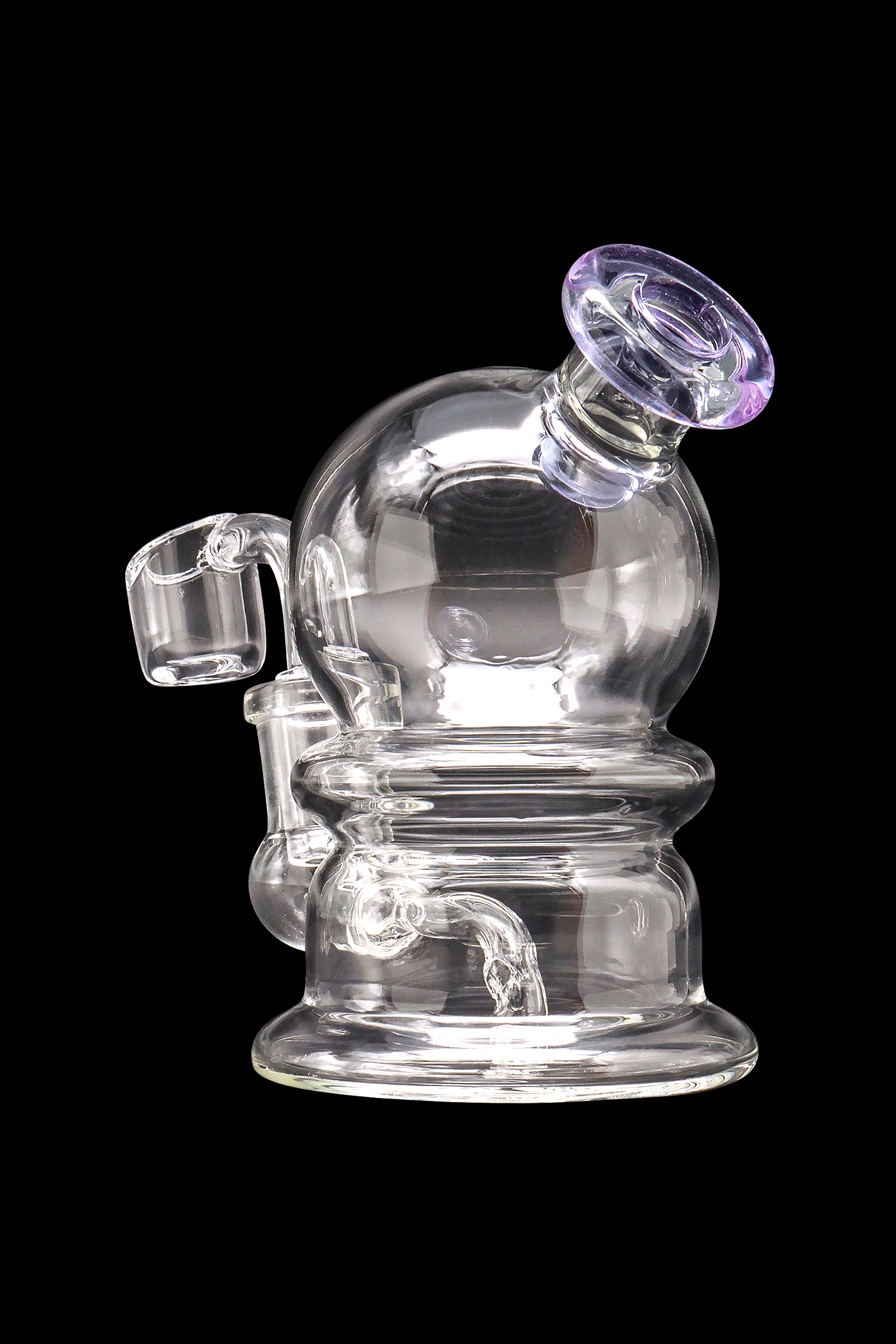 Clear glass dab rig with quartz banger, isolated on a black background.