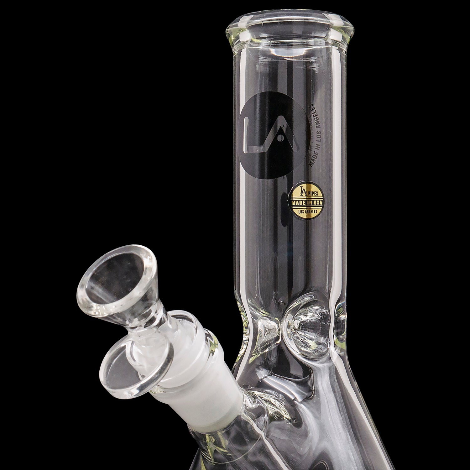 A studio shot of the LA Pipes Basic Beaker Water Pipe - Simply Guy, displaying its clear glass construction and beaker shape.