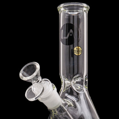 A studio shot of the LA Pipes Basic Beaker Water Pipe - Simply Guy, displaying its clear glass construction and beaker shape.