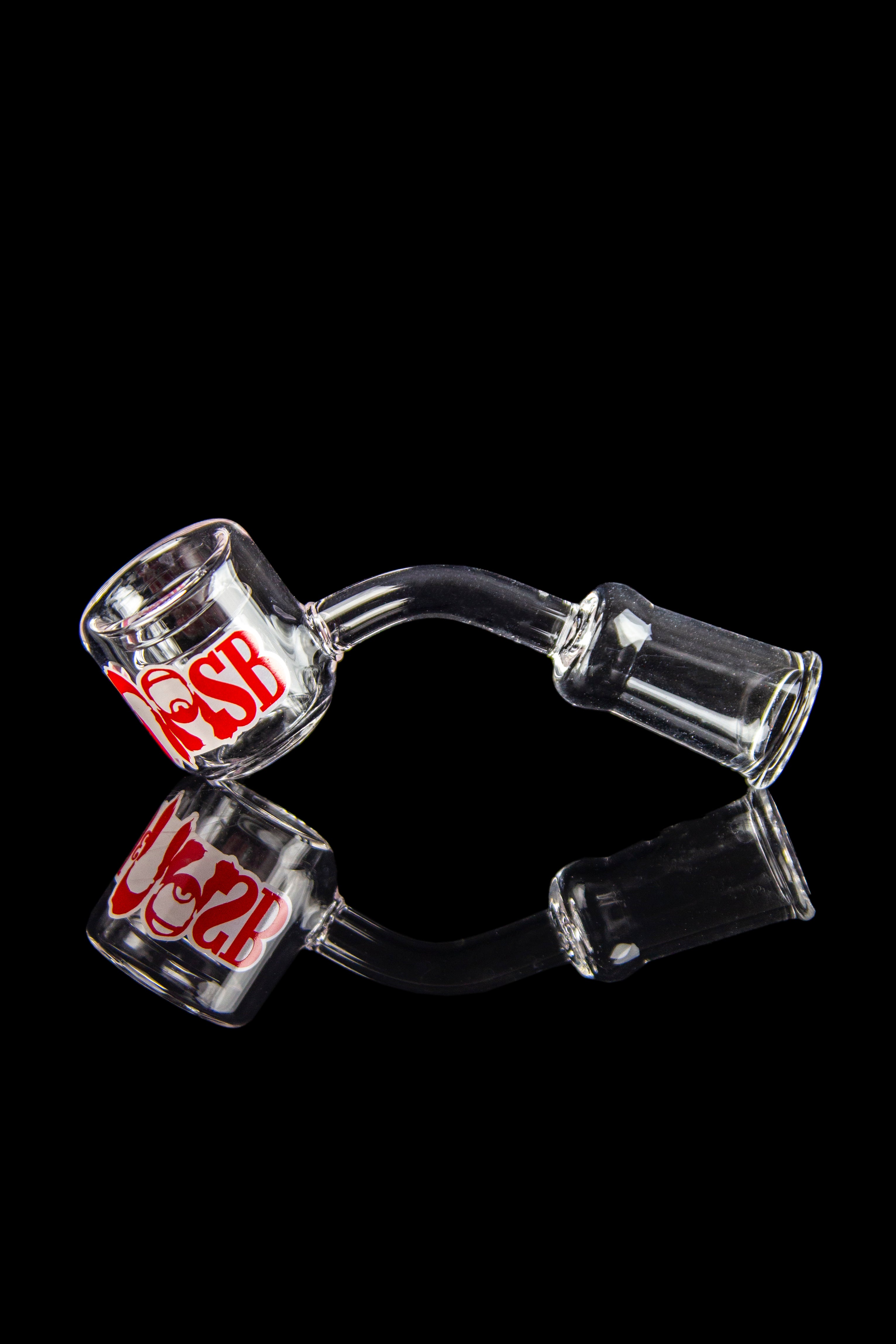 Clear glass dab rig with red logo and reflective surface.