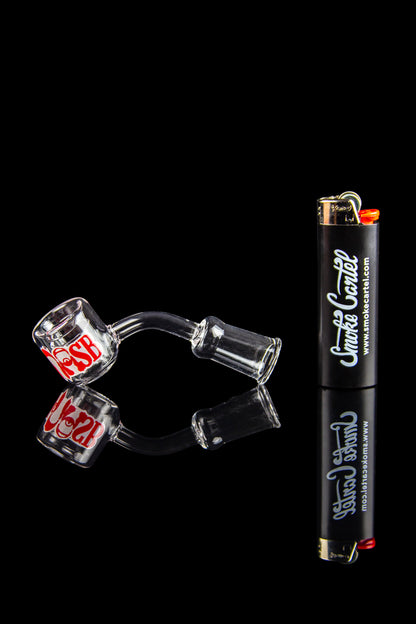 Glass cannabis pipes and lighter against a black background.