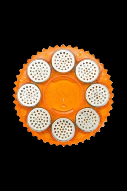 Overhead view of the Storz & Bickel Magazine with 8 dosing capsules, displaying a circular arrangement of capsule slots.