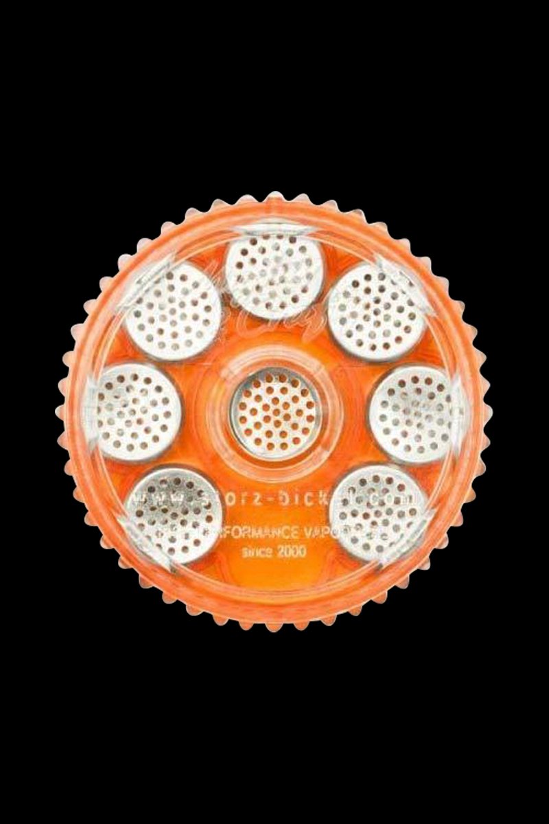 Overhead view of the Storz & Bickel Magazine, displaying eight circular dosing capsules arranged within its pale orange housing.