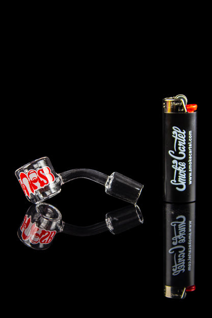 Glass cannabis smoking pieces and lighter against a black background.