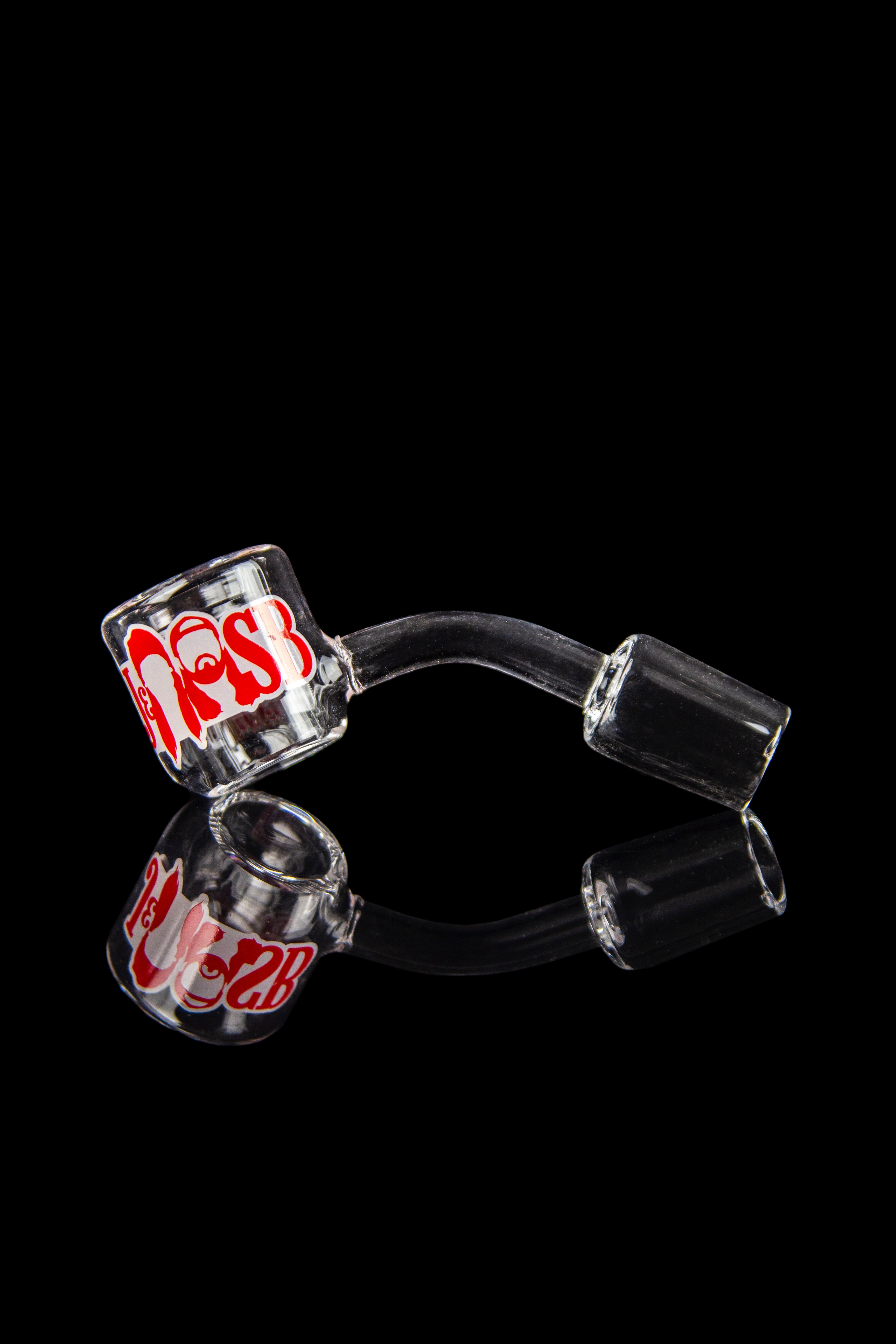 Glass cannabis oil rig components on a black background.