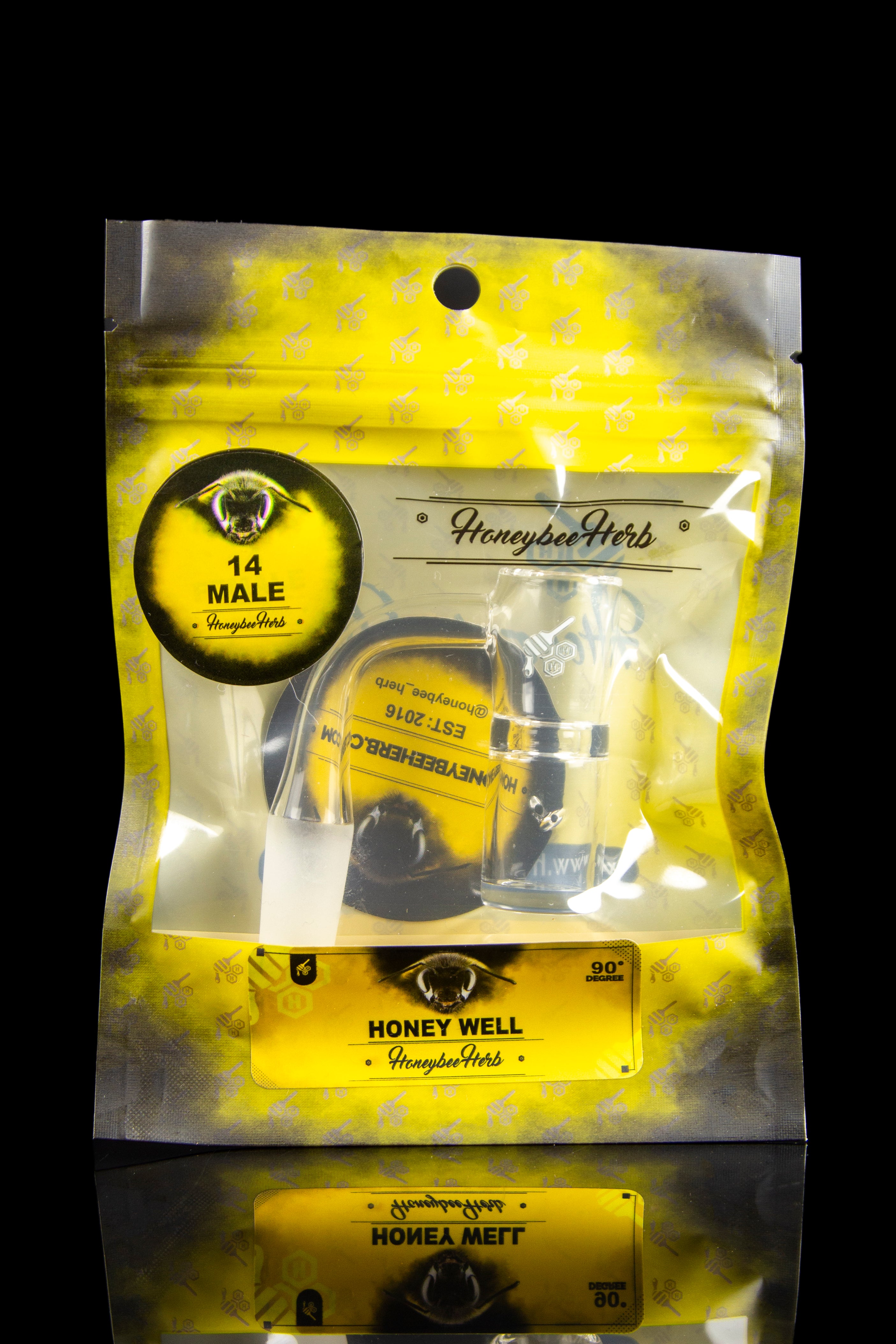 A sealed, gold mylar bag labeled “Honeybee Herb” with a black circular logo featuring an eye design, marketed as “14 Male” and “Honey Well.”
