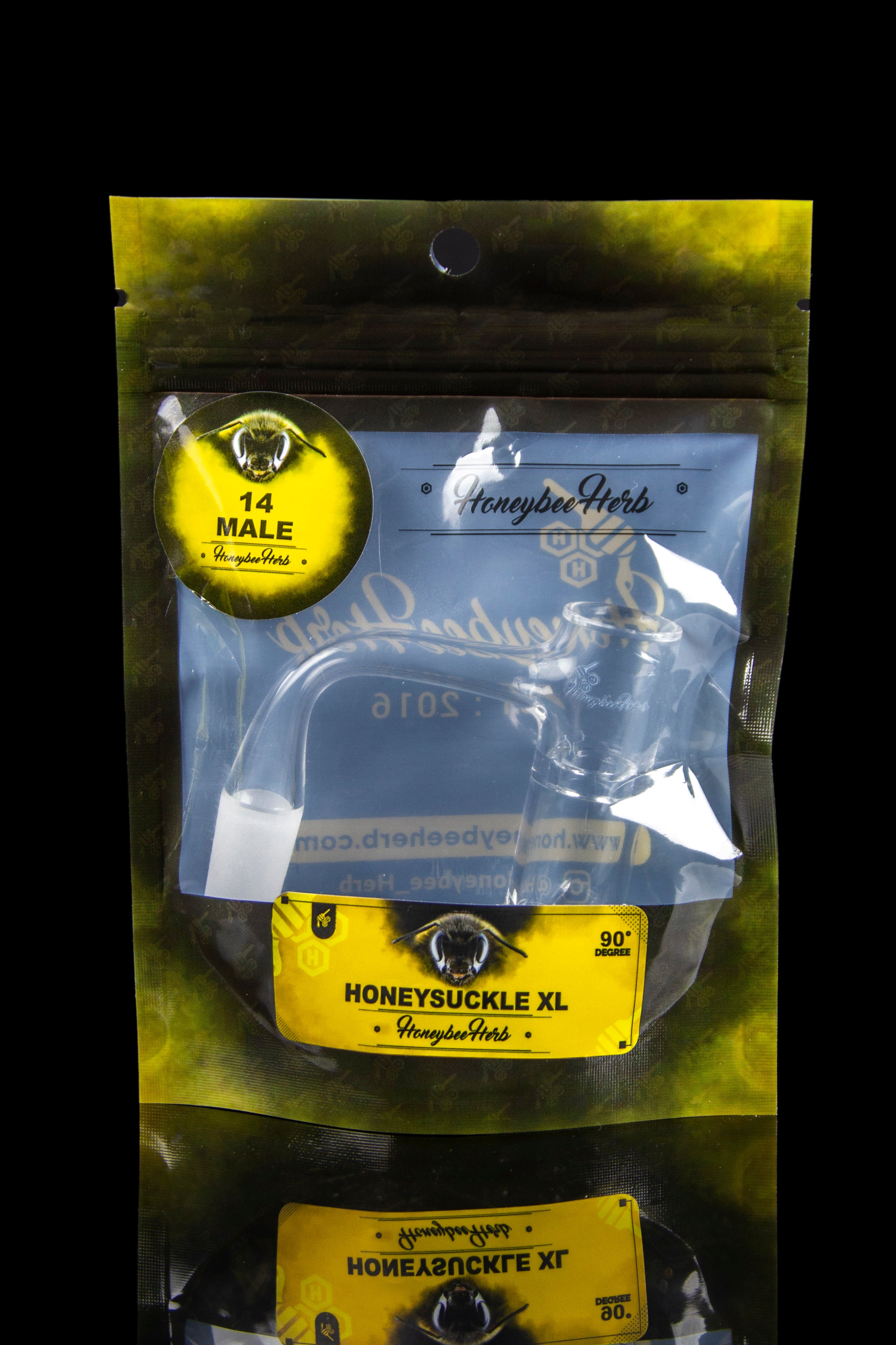 A sealed, gold mylar bag labeled "Honeysuckle XL" with cannabis leaf imagery and branding.