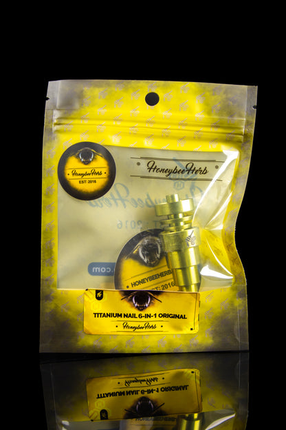 Gold mylar bag of Honeybee Herb titanium nail for dabbing cannabis concentrates, displaying the product and branding.