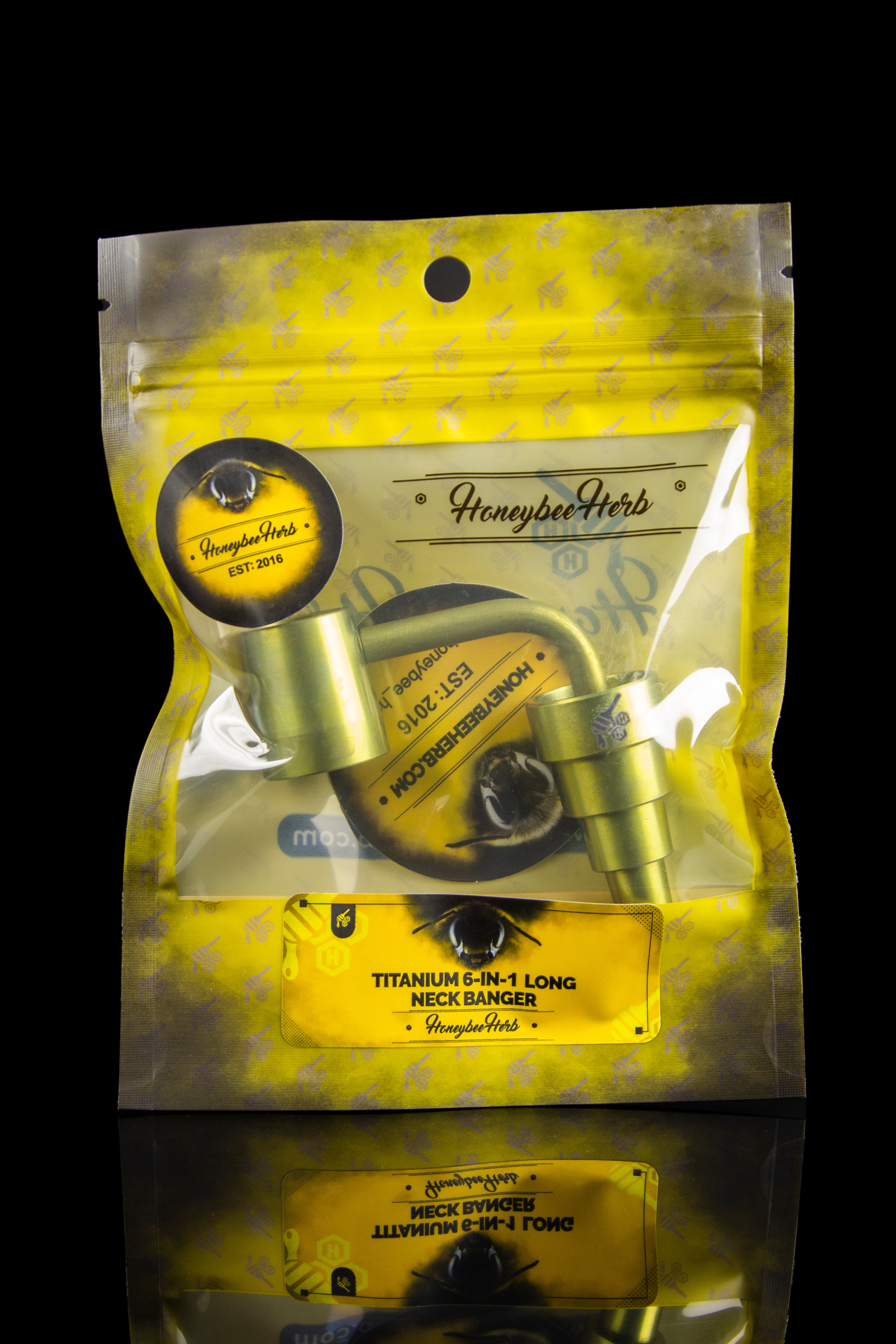 Gold foil bag of “Honeybee Herbs” branded titanium cannabis concentrate banger.