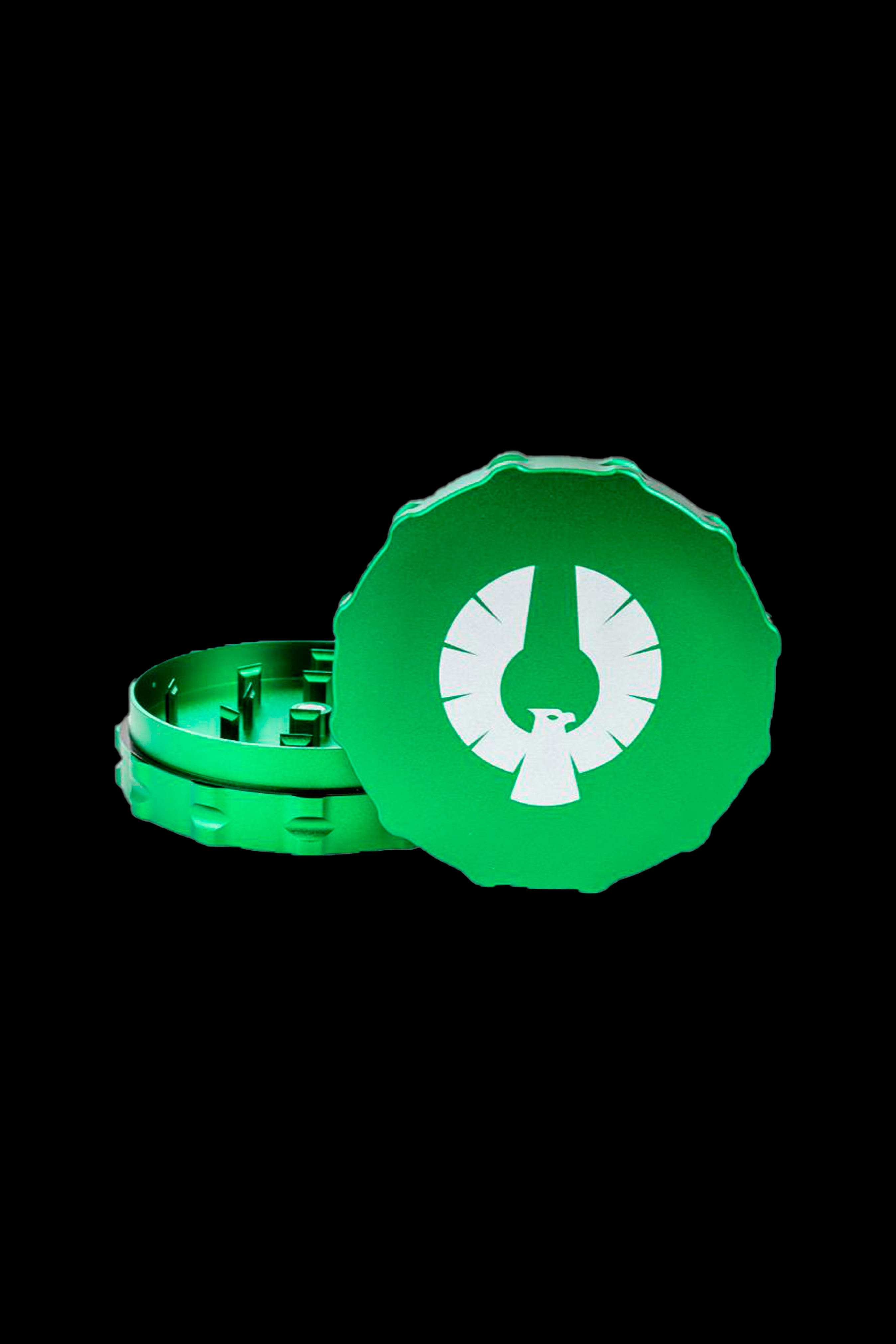 Green cannabis grinder with a white phoenix logo, open and closed halves separated.