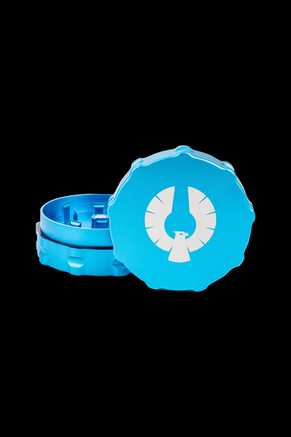 Blue cannabis grinder with a white eagle emblem.