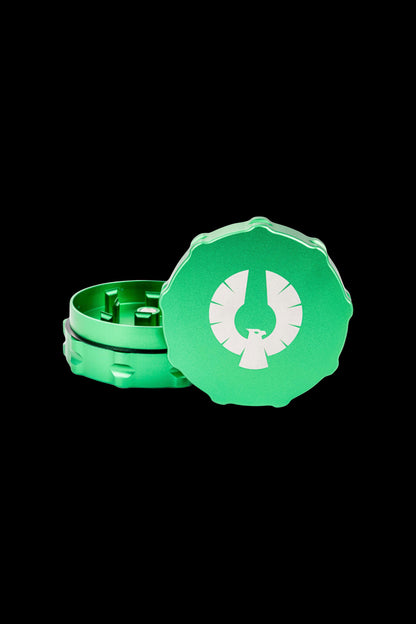 Emerald green cannabis grinder with a stylized bird logo.