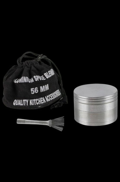 A close-up, angled view of the Metal 4-Piece Grinder, showcasing its cylindrical, multi-tiered metal construction.