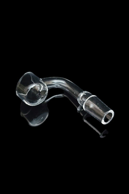 Clear glass dab nail with reflection on black background.