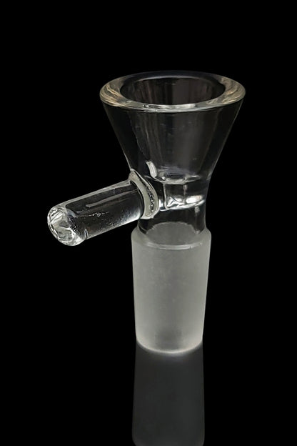 Clear glass bowl piece for a water pipe, reflecting on a dark surface.