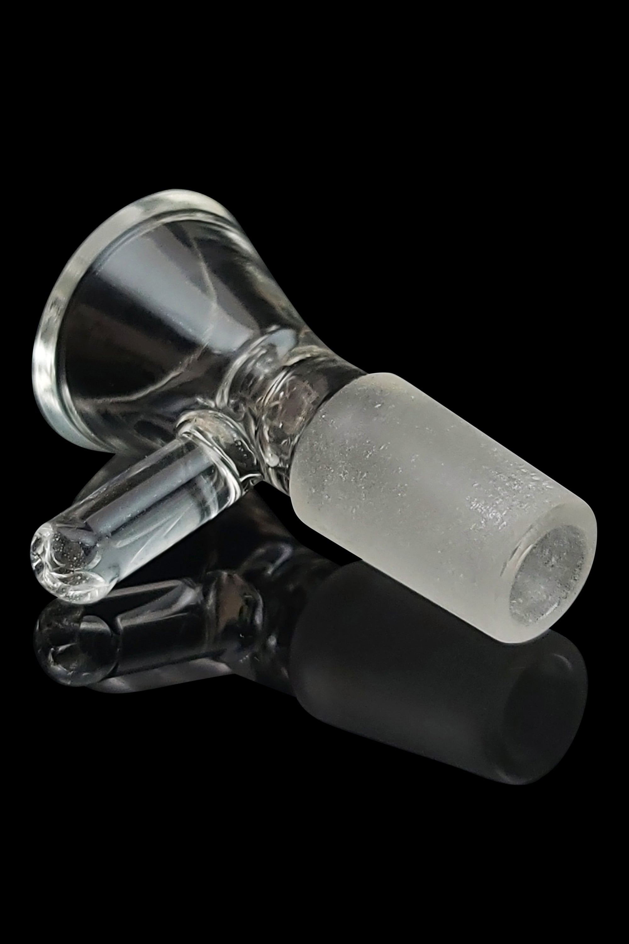 Clear glass bowl for smoking cannabis, displayed on a reflective surface.