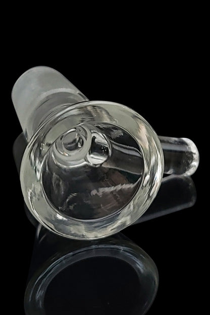 Clear glass cannabis bowl with visible interior, reflecting light, on a black surface.