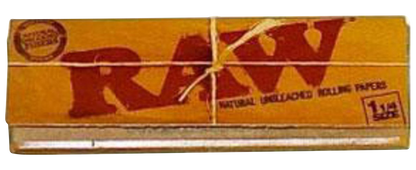 A close-up, angled view of the RAW Classic 1 1/4" Rolling Papers package, displaying the brand's logo on a brown paper background.
