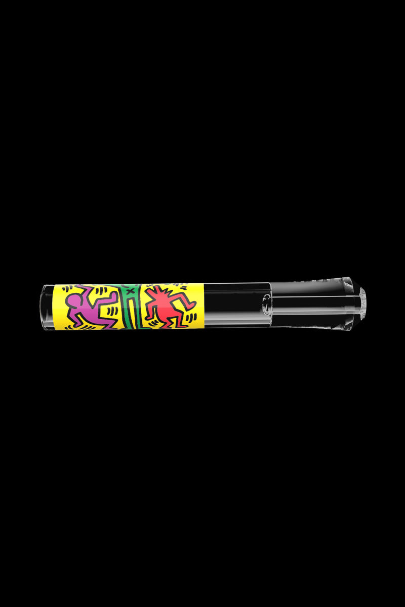 A straight-on view of the K.Haring Taster Chillum Pipe, featuring bold, graphic designs on a dark background.