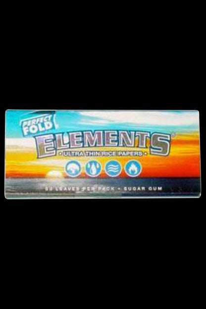 Front view of the Elements Ultra Thin Perfect Fold Rice Rolling Papers package, with bold branding and a dark background.