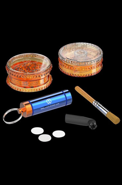 A close-up shot of the Storz & Bickel Side Kit components arranged on a dark background, featuring a small, cylindrical container and mesh screens.