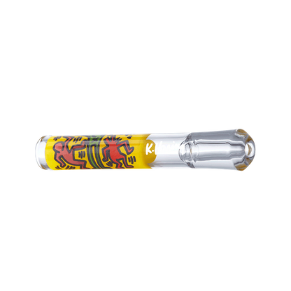A close-up shows the K.Haring Taster Chillum Pipe, a clear glass pipe with colorful, abstract artwork.