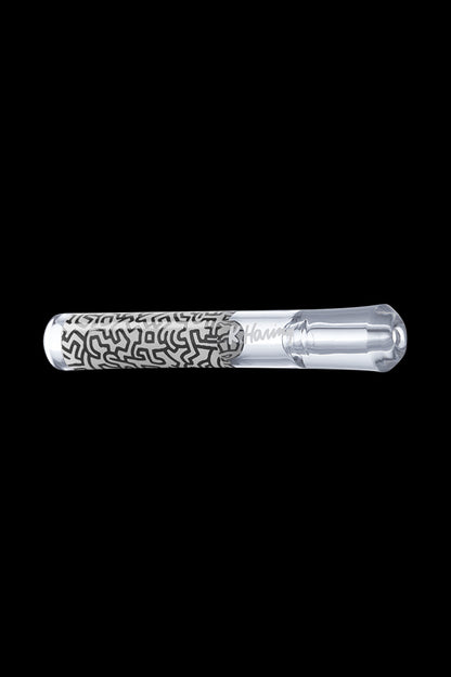 A straight-on view of the K.Haring Taster Chillum Pipe, showcasing its simple, handheld design against a dark background.