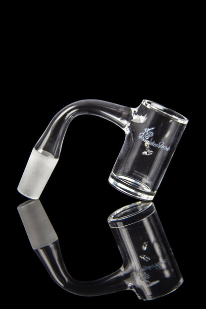 Clear glass oil rig with a curved mouthpiece and joint, reflected on a black surface.