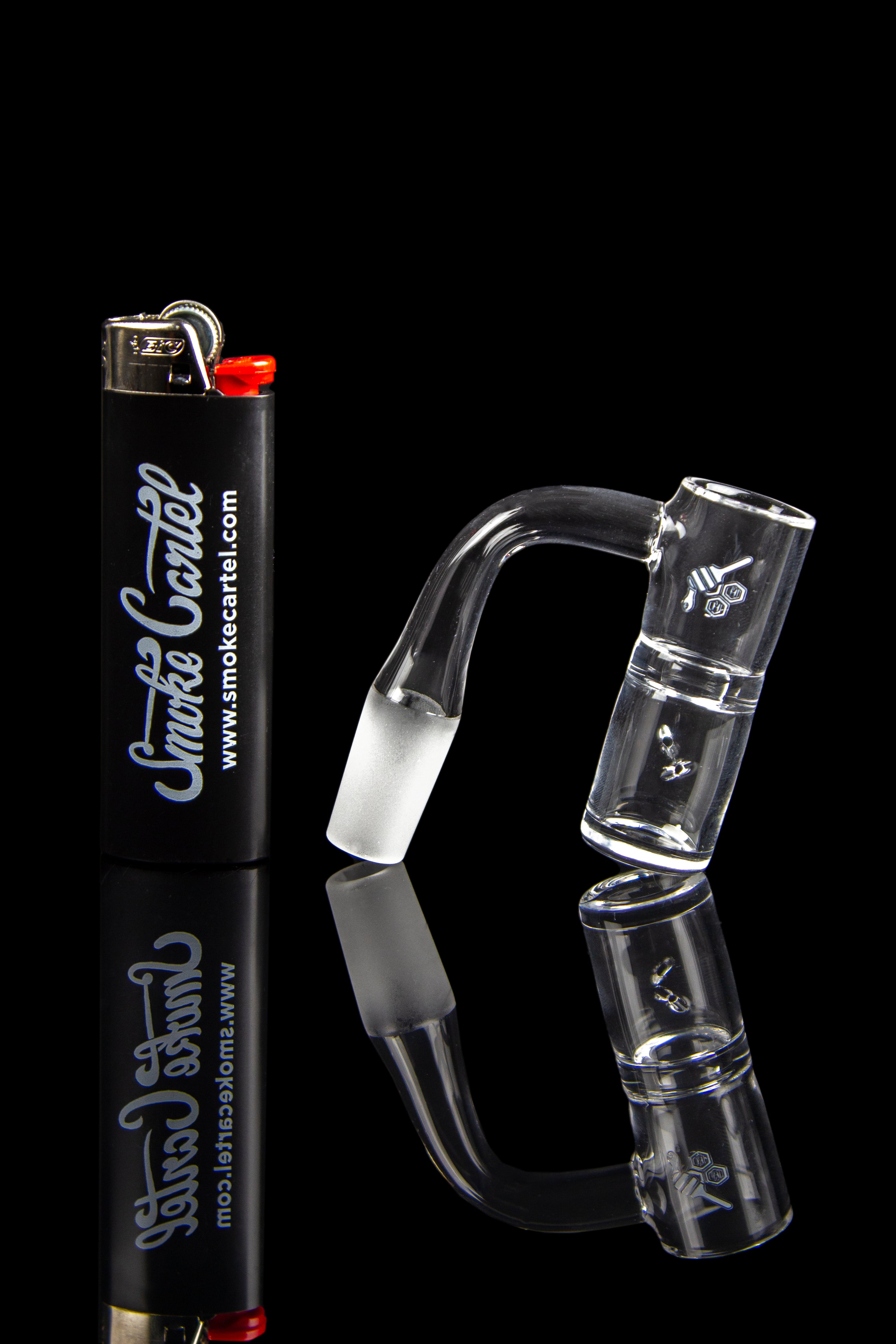 Glass dab rig with accessories and lighter, branded with "Smoke Cartel" logo on a black background.