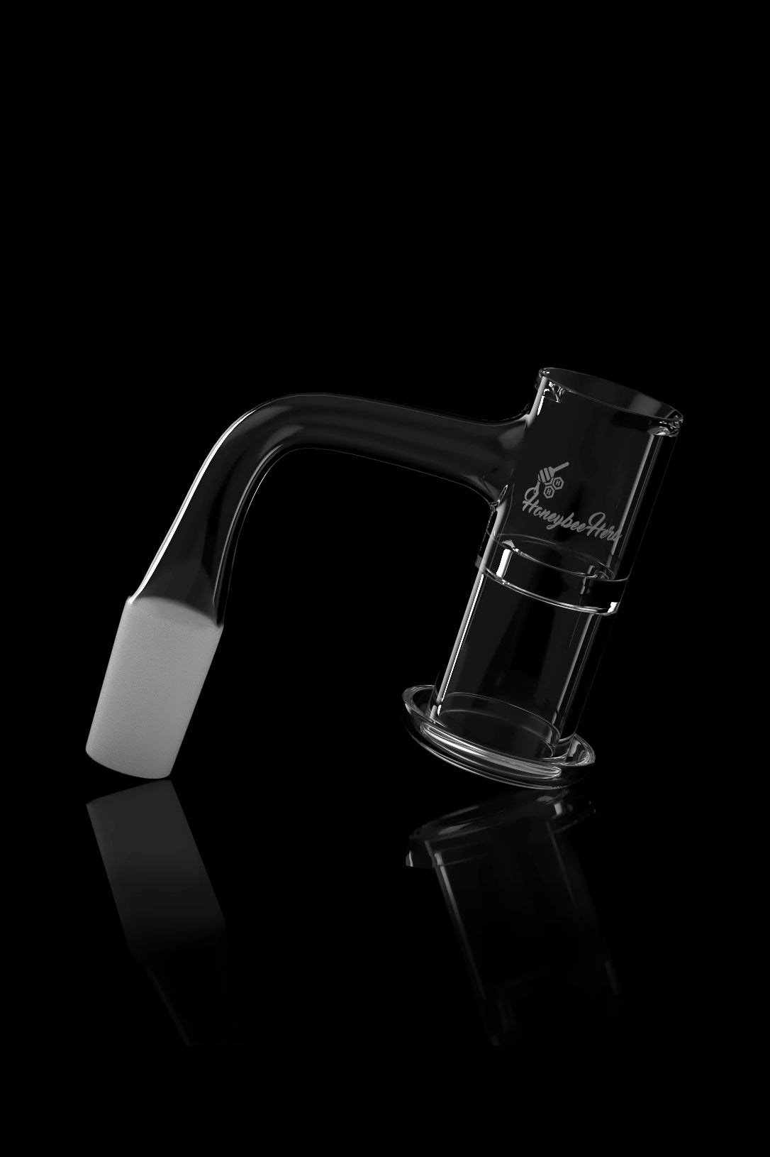 Clear glass dab rig with branding, reflecting on a black surface.