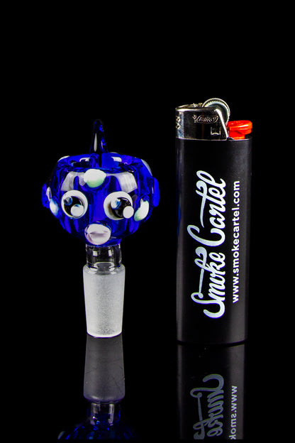 Blue glass cannabis bubbler and lighter with "Smoke Cartel" branding.