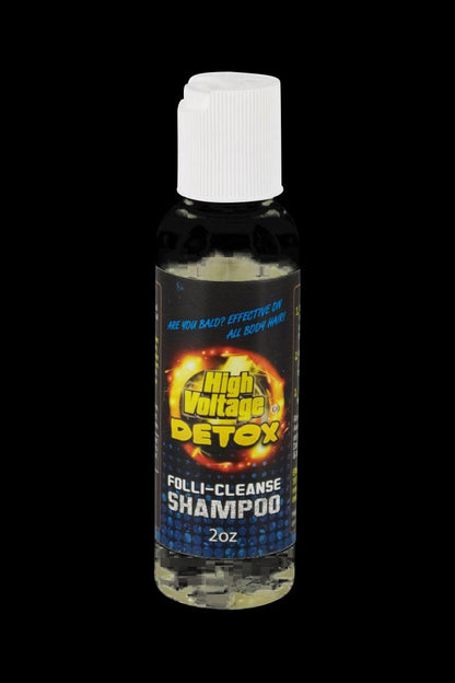 Front view of the 2oz High Voltage Detox Folli-Cleanse Shampoo bottle with a vibrant label against a dark background.