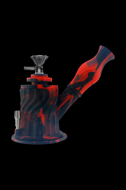 Red and black glass water pipe (bong) isolated on a black background.