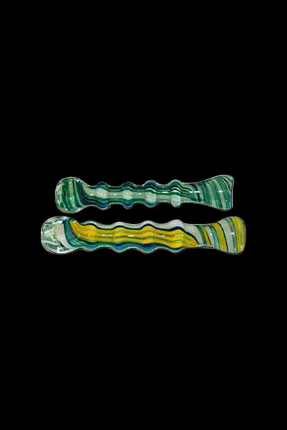 A close-up shows the Ribbed Twisted Stripe Pattern Glass Taster, displaying its ribbed texture and twisted stripe design against a black background.